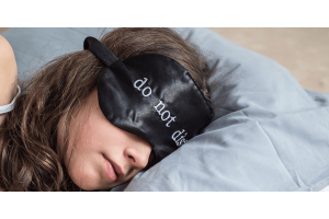 Girl sleeping with a night mask