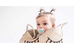 Cute baby in a basket