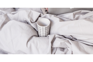 Cup of water in bed