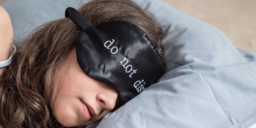 Girl sleeping with a night mask